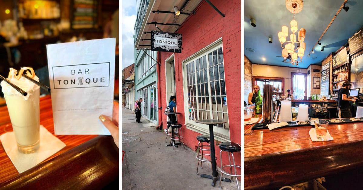 a tall cocktail glass, filled with a Ramos Gin Fizz, at Bar Tonique in New Orleans; red brick wall and white lattice windows, wooden bar